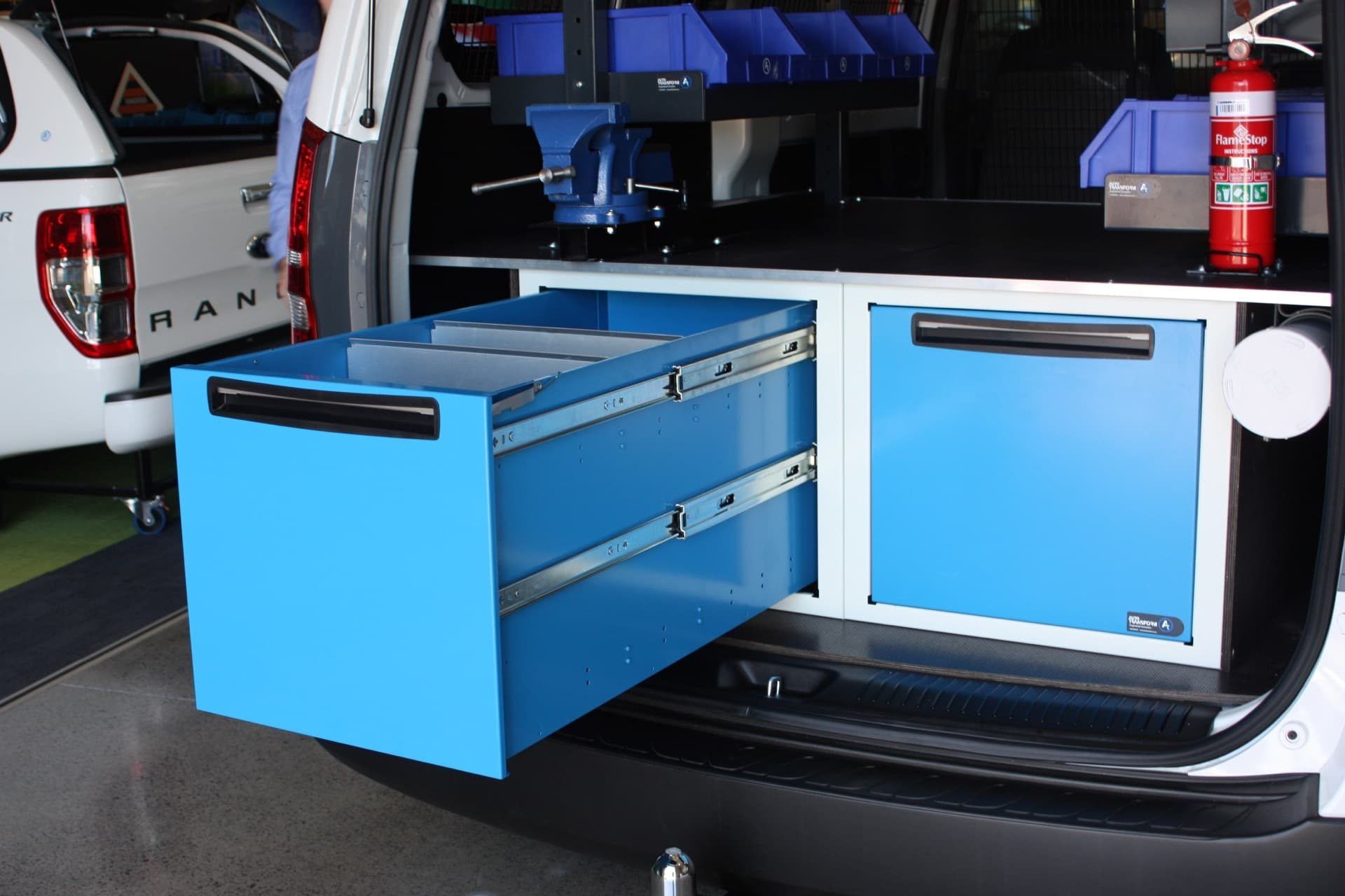 Bin drawer storage system in vehicle