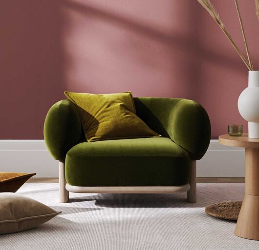 Weave Nova Lichen velvet look cushion on green chair
