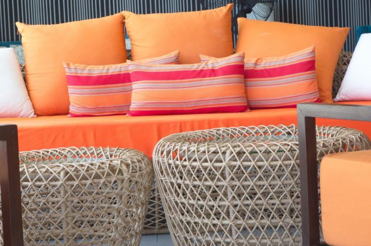 orange sofa with the colorful pillows  x