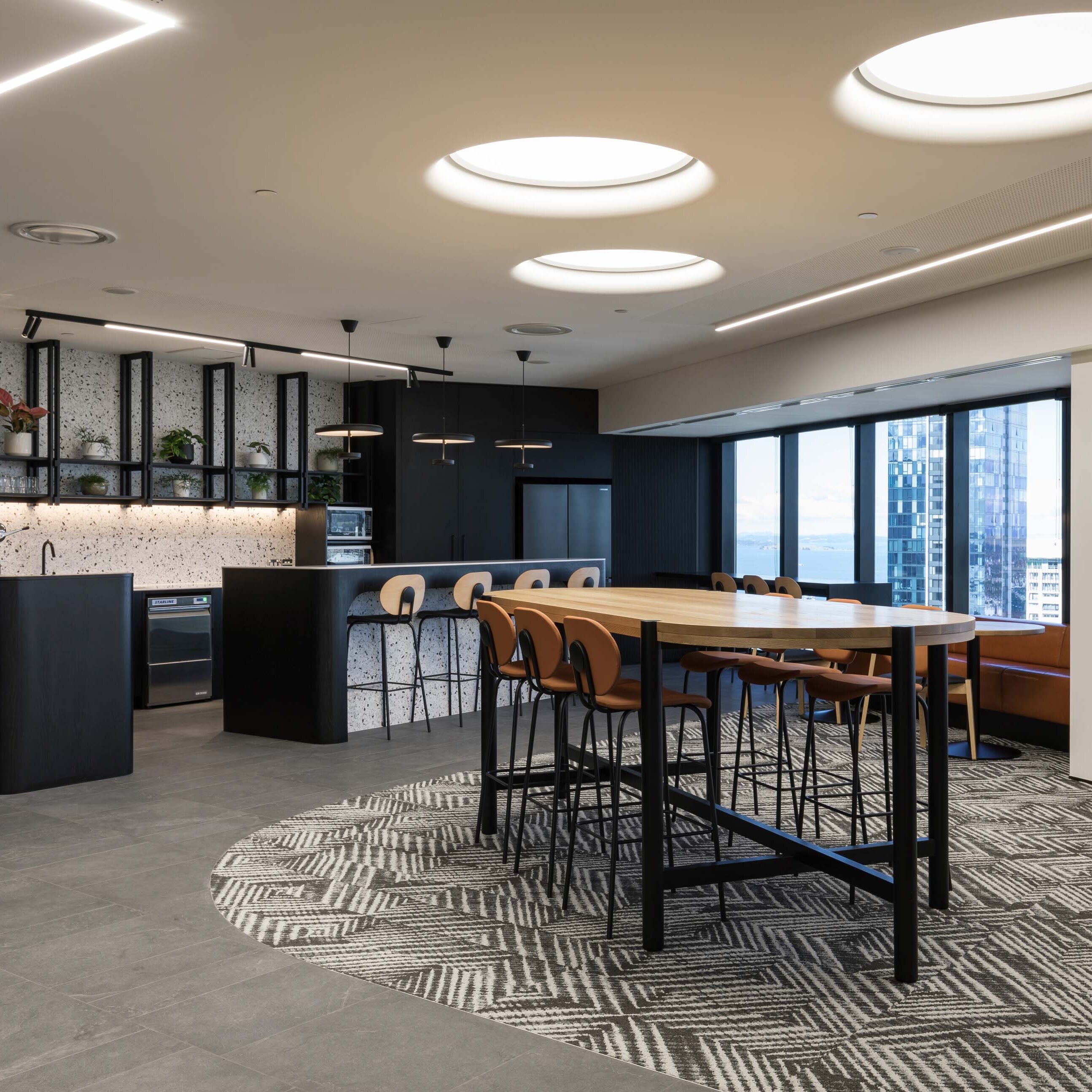 Office cafeteria and breakout spaces at CBRE Auckland